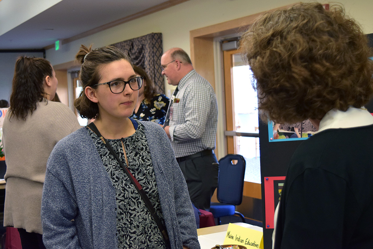 Natalie McCarthy, the 2023 outstanding graduating student in elementary education from the app College of Education and Human Development, talks to an employer at the college's 2023 education career fair.