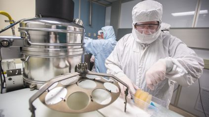 Scientists in clean room laboratory