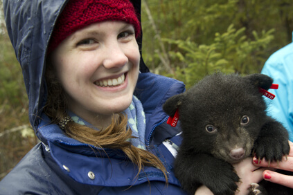 Student with bear cub